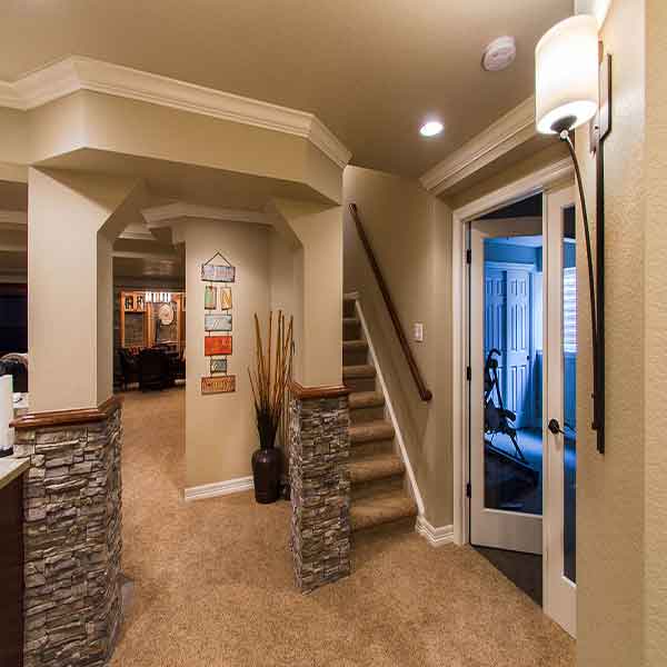 An added exercise room to a beautifully done basement