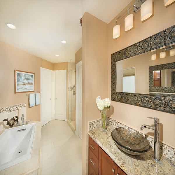 Light colored bathroom with beautiful accents